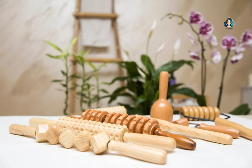 Dry Massage vs Oil Massage comparison featuring professional dry massage equipment, massage table, towels, and spa accessories.
